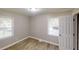 Bedroom with wood-look floors and natural light from two windows at 568 Mcwilliams Se Rd, Atlanta, GA 30315