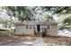 Charming one-story home with a brick facade, black front door and a cozy front porch at 568 Mcwilliams Se Rd, Atlanta, GA 30315