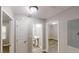 Hallway showcasing modern floors, neutral paint, and access to various rooms in the home at 568 Mcwilliams Se Rd, Atlanta, GA 30315