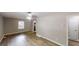 Spacious living room featuring new floors, a ceiling fan, and plenty of natural light at 568 Mcwilliams Se Rd, Atlanta, GA 30315