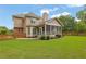The backyard features a fenced yard, a screened in porch, and mature trees at 1304 Swallows Walk, Grayson, GA 30017