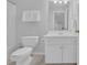 Bathroom with white vanity, tiled floor, shower with curtain, and a large mirror at 1304 Swallows Walk, Grayson, GA 30017