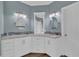 Elegant bathroom with dual vanities, granite countertops, and modern lighting fixtures at 1304 Swallows Walk, Grayson, GA 30017
