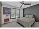 Modern bedroom with stylish black accent wall, cozy queen bed, and natural light at 1304 Swallows Walk, Grayson, GA 30017