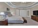 Bright bedroom with tray ceilings, large windows, and access to outdoor patio at 1304 Swallows Walk, Grayson, GA 30017