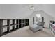 Bright bonus room featuring custom built-ins, comfortable seating, and ample natural light at 1304 Swallows Walk, Grayson, GA 30017