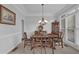 Formal dining room featuring a chandelier and large windows for natural light at 1304 Swallows Walk, Grayson, GA 30017