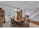 Formal dining room with chandelier and natural light at 1304 Swallows Walk, Grayson, GA 30017