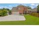 The exterior boasts an attached garage with a wide driveway at 1304 Swallows Walk, Grayson, GA 30017