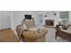Comfortable living room with a fireplace and ample natural light at 1304 Swallows Walk, Grayson, GA 30017