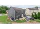 View of the home's backyard showcasing ample green space and an outdoor patio with a shed at 1657 Bradmere Ln, Lithia Springs, GA 30122
