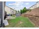 Spacious backyard featuring a metal shed, a retaining wall, and ample space for outdoor activities at 1657 Bradmere Ln, Lithia Springs, GA 30122