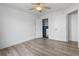Bright bedroom with modern flooring, ceiling fan, and spacious closet at 1657 Bradmere Ln, Lithia Springs, GA 30122