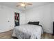 Clean bedroom with a ceiling fan, closet, light hardwood floors and a neutral color palette at 1657 Bradmere Ln, Lithia Springs, GA 30122