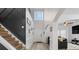 Spacious foyer with tall ceilings, decorative paneling, and a staircase leading to the upper level at 1657 Bradmere Ln, Lithia Springs, GA 30122