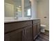Bathroom features a dual vanity, wood-look flooring and multiple mirrors at 2277 Whitworth St, Lawrenceville, GA 30044