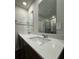 Bright bathroom featuring a double sink vanity with ample counter space and modern fixtures at 2277 Whitworth St, Lawrenceville, GA 30044