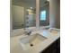 Bathroom dual sink vanity with white countertop and white sinks at 2277 Whitworth St, Lawrenceville, GA 30044