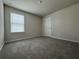 Cozy bedroom with neutral carpet and large window at 2277 Whitworth St, Lawrenceville, GA 30044