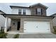 Charming two-story home with brick and stone accents and a two car garage at 2277 Whitworth St, Lawrenceville, GA 30044