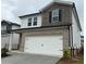 Charming two-story home with brick and stone accents and a two car garage at 2277 Whitworth St, Lawrenceville, GA 30044