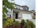 Charming two-story home with brick and stone accents and a two car garage at 2277 Whitworth St, Lawrenceville, GA 30044