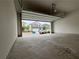 Spacious garage with an open door showing the home's front elevation in the distance at 2277 Whitworth St, Lawrenceville, GA 30044