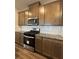 Modern kitchen features stainless steel appliances and granite countertops at 2277 Whitworth St, Lawrenceville, GA 30044
