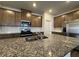 Gourmet kitchen with granite island, stainless appliances, and custom cabinetry at 2277 Whitworth St, Lawrenceville, GA 30044