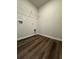 Functional laundry room with vinyl floors, hookups for appliances, and overhead wire shelving at 2277 Whitworth St, Lawrenceville, GA 30044