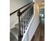 Carpeted staircase with decorative wooden railing at 2277 Whitworth St, Lawrenceville, GA 30044