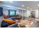 Finished basement featuring a comfortable gray sectional sofa and modern decor at 2849 Crescendo Dr, Atlanta, GA 30318