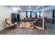 Spacious finished basement with gray sectional, large windows and wood-look floors at 2849 Crescendo Dr, Atlanta, GA 30318
