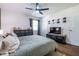 This bedroom features a TV, ceiling fan, hardwood floors, dresser and a wall with baseball caps at 2849 Crescendo Dr, Atlanta, GA 30318