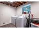 Basement laundry room with a modern washer and dryer, offering convenience and functionality at 2849 Crescendo Dr, Atlanta, GA 30318