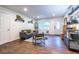 Cozy living room featuring hardwood floors, comfortable sofa, stylish decor, and a bright front entry at 2849 Crescendo Dr, Atlanta, GA 30318
