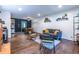 Open living room featuring hardwood floors, comfortable seating, decor, with a view of the dining area at 2849 Crescendo Dr, Atlanta, GA 30318