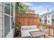 Inviting back porch features comfortable seating and string lights for relaxing outdoor living at 4202 Deming Cir, Sandy Springs, GA 30342