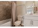 This bathroom features tile walls, a shower/tub combo, and a modern white vanity at 4202 Deming Cir, Sandy Springs, GA 30342