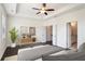 Bedroom showing decor, ceiling fan, and ensuite bath with walk-in closet at 4202 Deming Cir, Sandy Springs, GA 30342