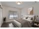 Comfortable bedroom with natural light, neutral tones, and dark hardwood flooring at 4202 Deming Cir, Sandy Springs, GA 30342