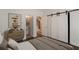 Light-filled bedroom offers dark hardwood floors, sliding doors, and a serene atmosphere at 4202 Deming Cir, Sandy Springs, GA 30342