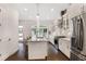Modern kitchen featuring a large island, stainless appliances, and an open layout at 4202 Deming Cir, Sandy Springs, GA 30342