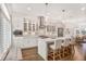 Modern kitchen featuring stainless steel appliances, pendant lighting, and an island with seating at 4202 Deming Cir, Sandy Springs, GA 30342