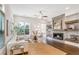 Comfortable living room featuring a fireplace, hardwood floors, and large windows at 4202 Deming Cir, Sandy Springs, GA 30342