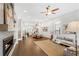 Open-concept living featuring hardwood floors, fireplace, modern furniture and dining area at 4202 Deming Cir, Sandy Springs, GA 30342