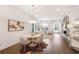Open-concept living featuring hardwood floors, fireplace, modern furniture and dining area at 4202 Deming Cir, Sandy Springs, GA 30342