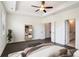A main bedroom includes a ceiling fan, dark hardwood floors, and ensuite bathroom at 4202 Deming Cir, Sandy Springs, GA 30342