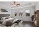 This is a spacious main bedroom featuring natural light and a ceiling fan for added comfort at 4202 Deming Cir, Sandy Springs, GA 30342