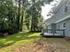 Expansive backyard with a deck and lush green trees at 4970 Clubgreen Smt, Stone Mountain, GA 30088